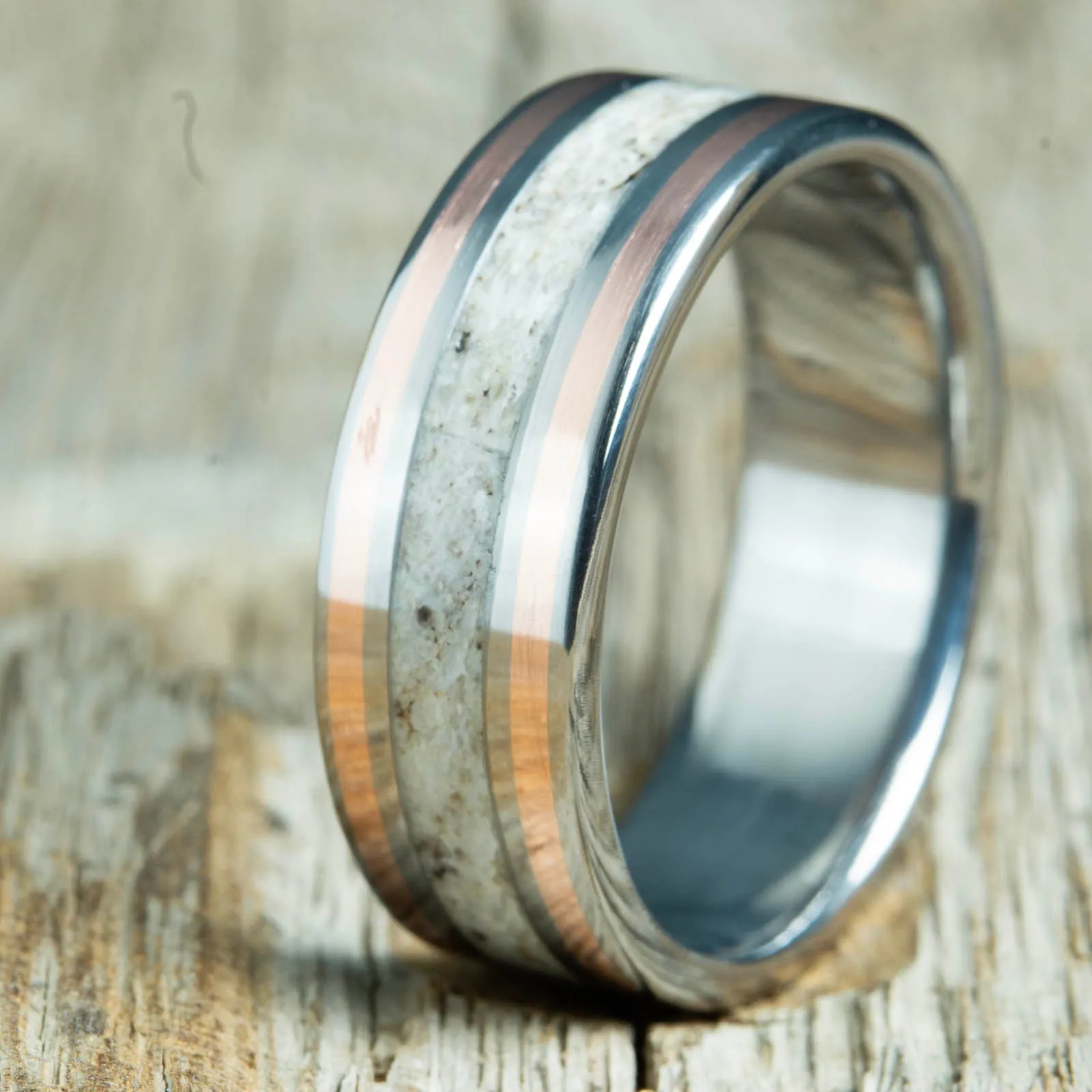 Antler ring with copper pinstripes on titanium