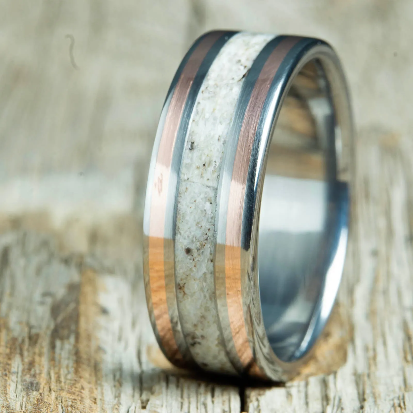 Antler ring with copper pinstripes on titanium