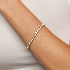 White Topaz Emerald Cut Tennis Bracelet in Gold